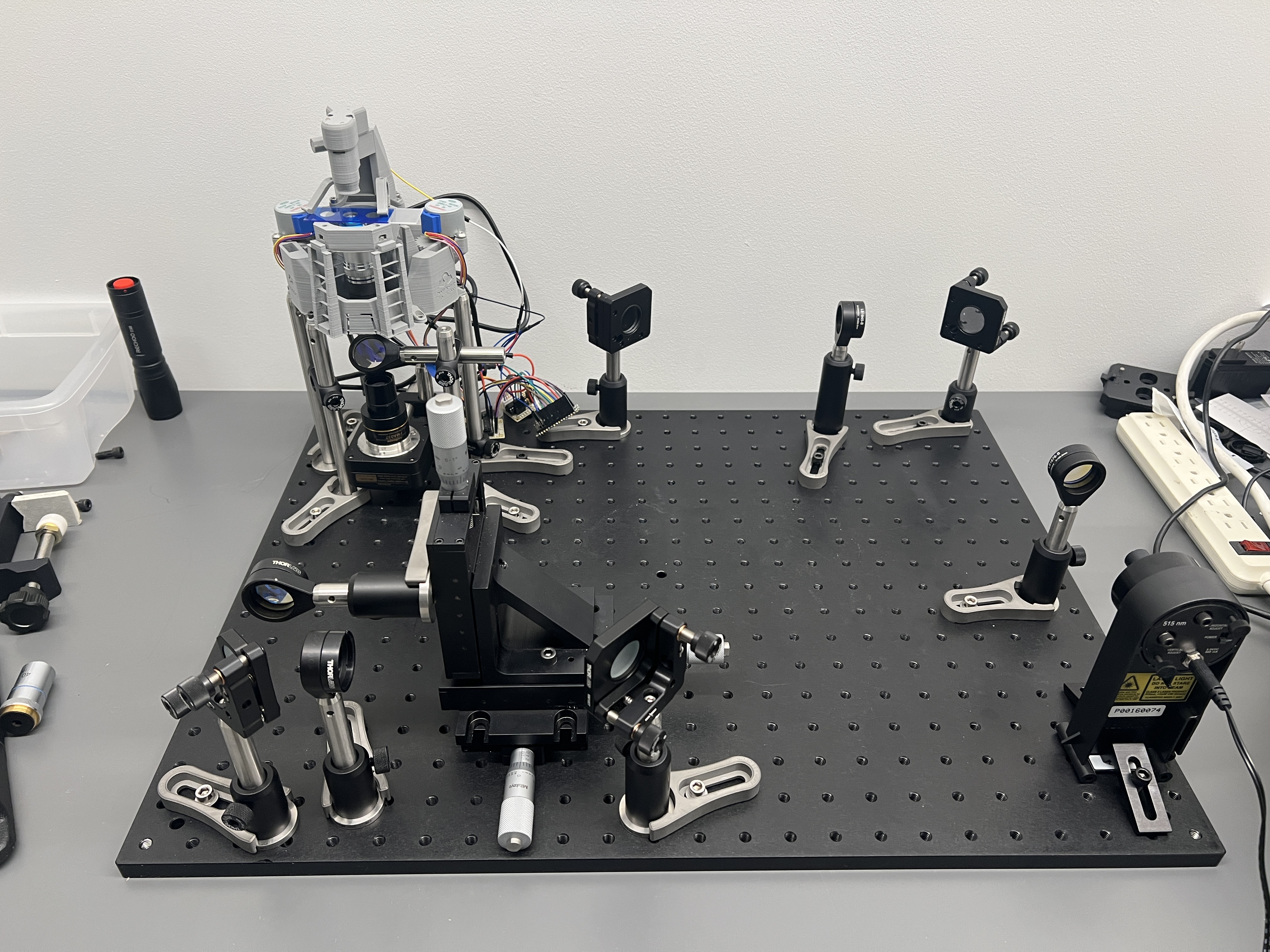 Another wide view of the optical tweezer prototype and optics table